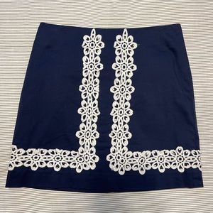 Lilly Pulitzer navy skirt with white lace detail. Good used condition.